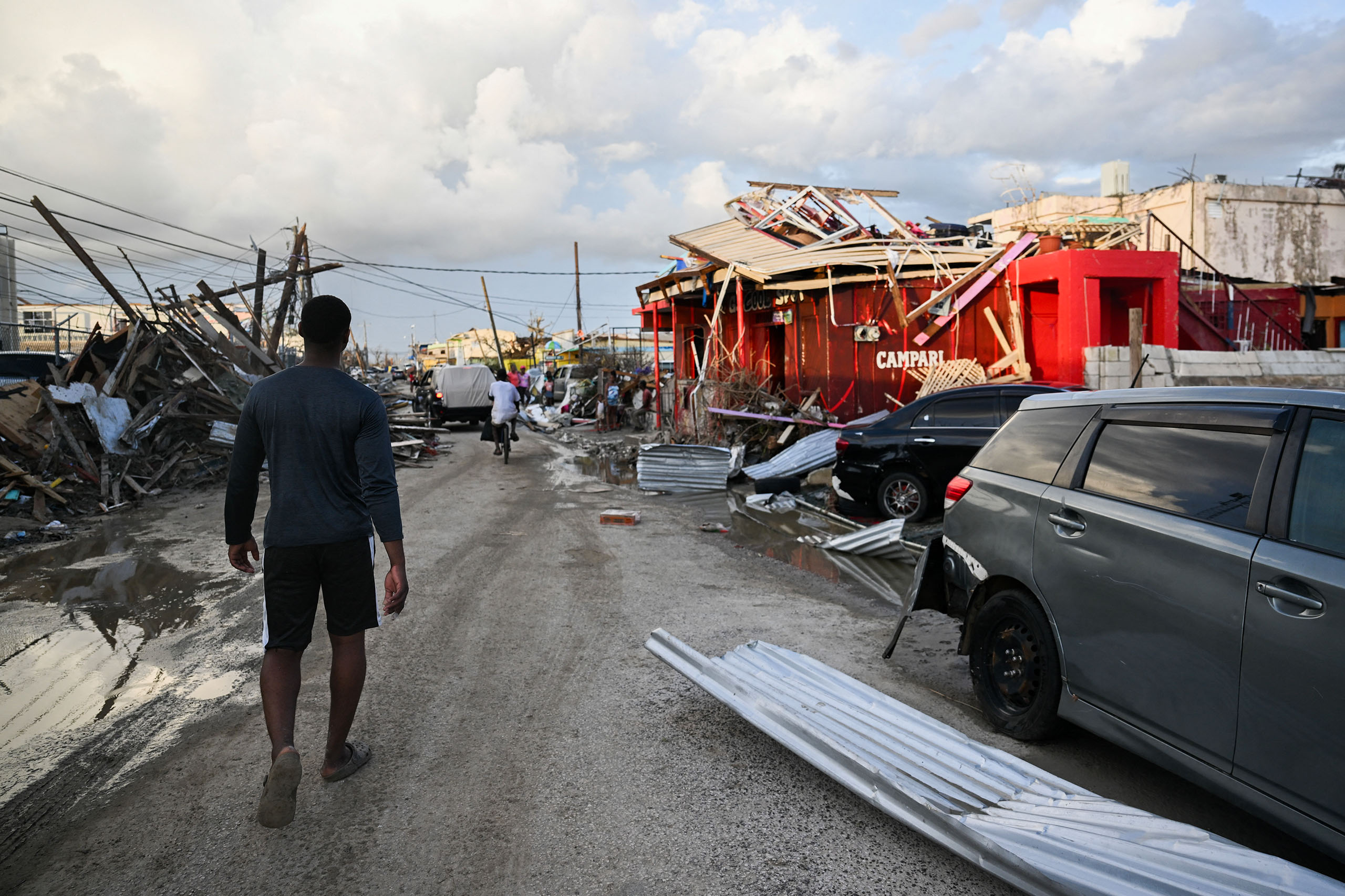 Shellshocked and homeless, survivors wait for aid to arrive