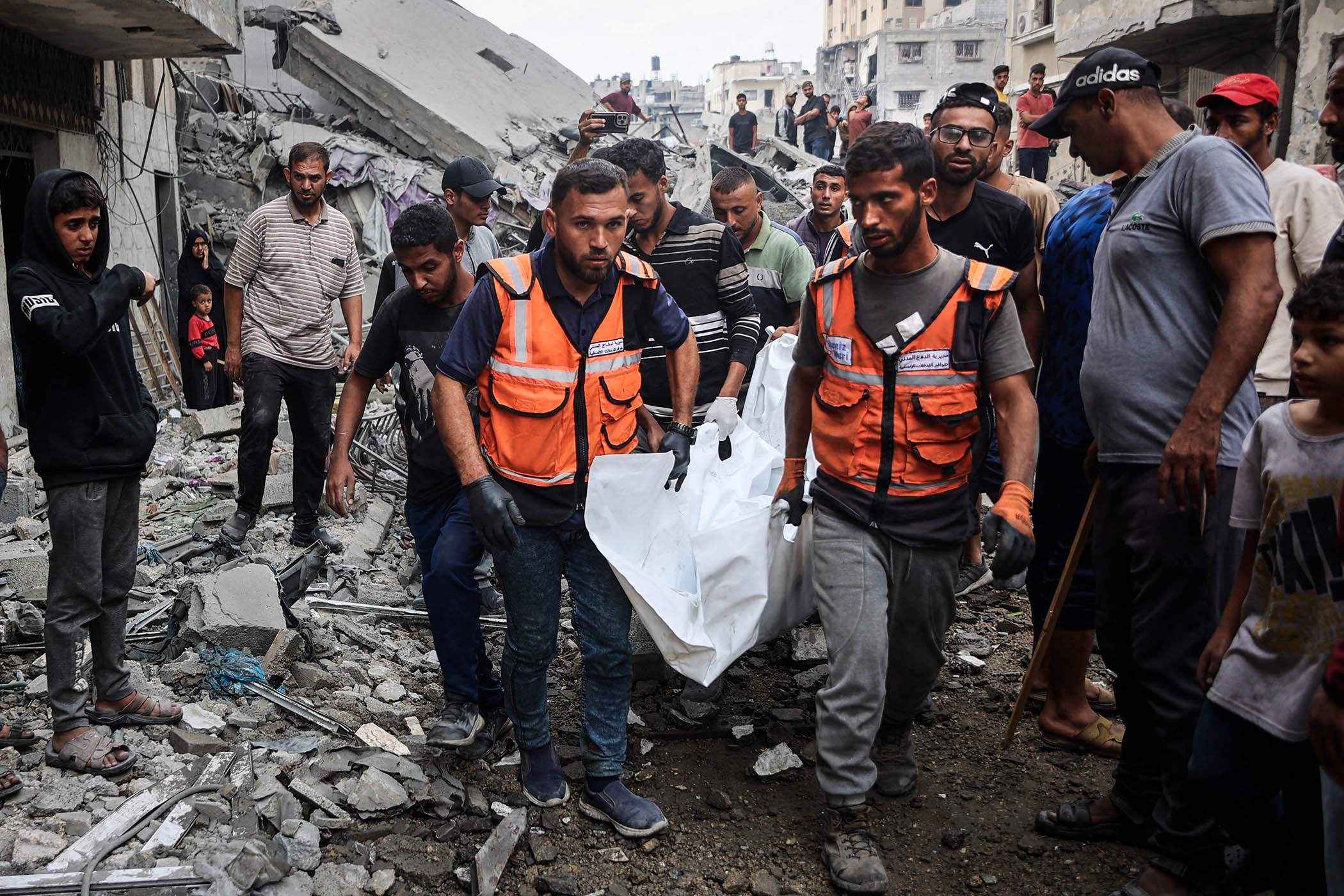 In the mass grave of Gaza, families dig for their loved ones beneath the rubble