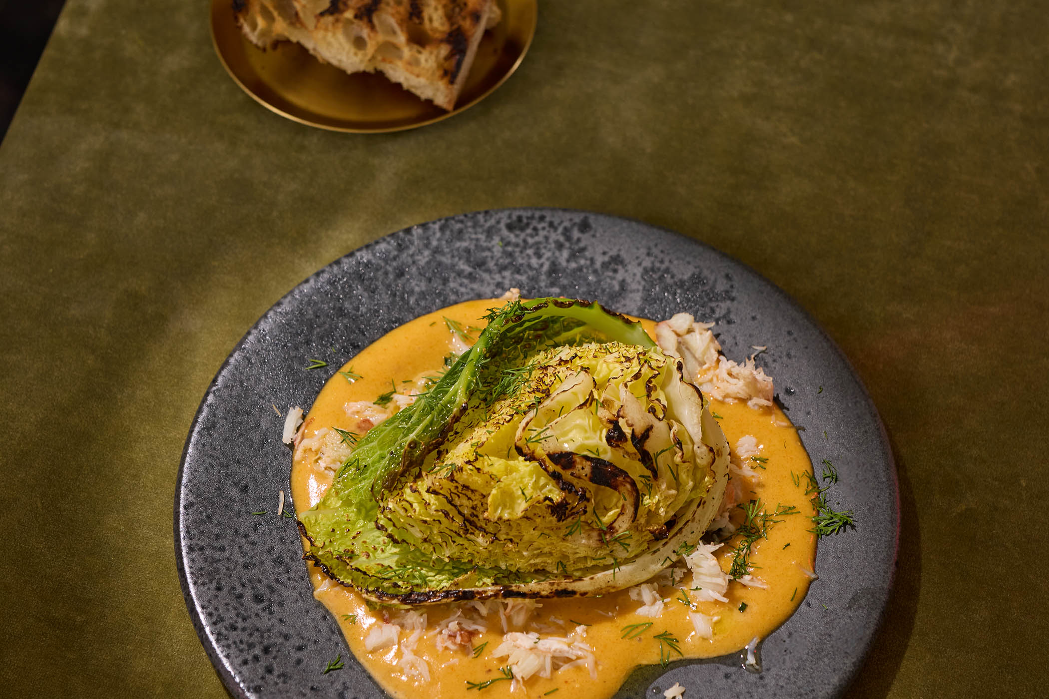 Grilled winter cabbage with crab mayonnaise and lemon oil